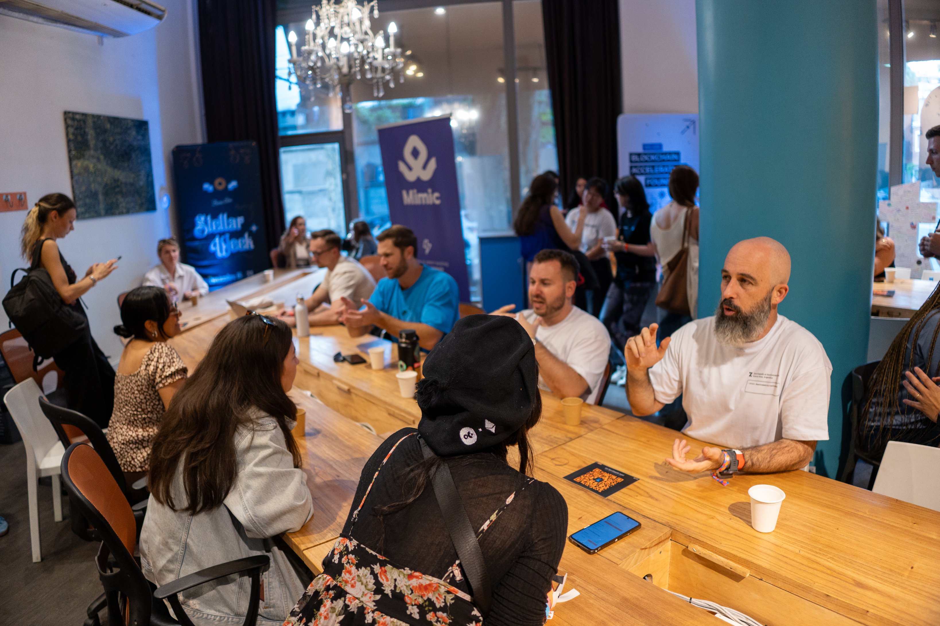 Builders networking with partners at a long hiring table