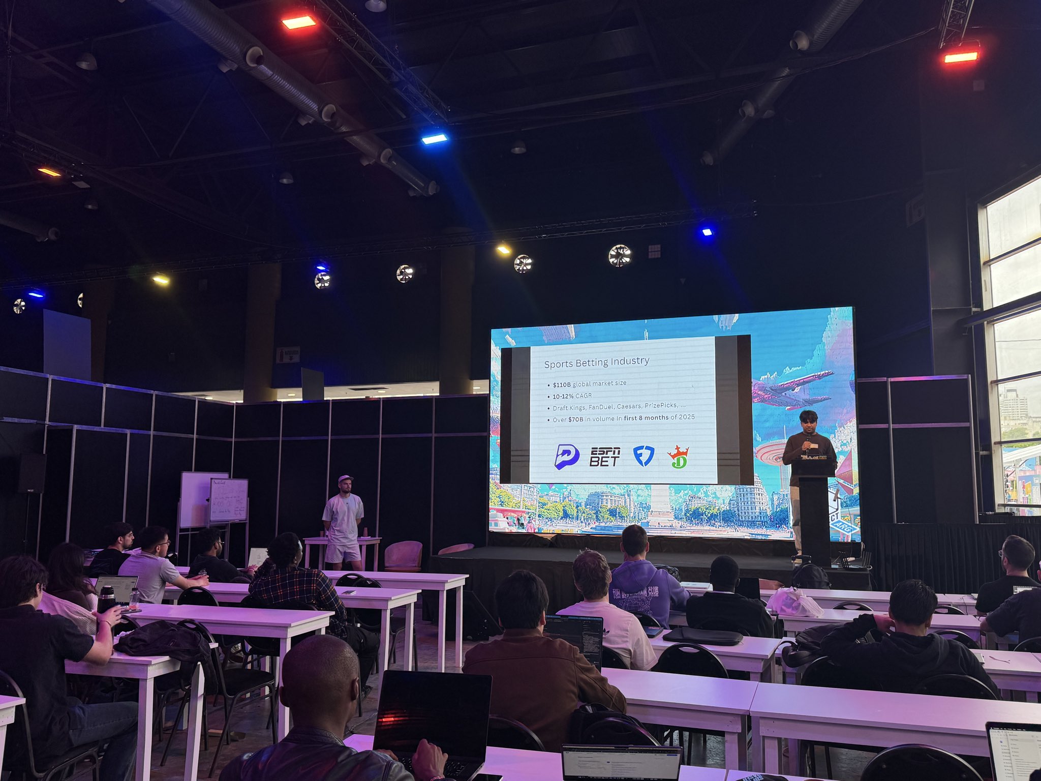 Builder pitching on stage at a previous talent competition